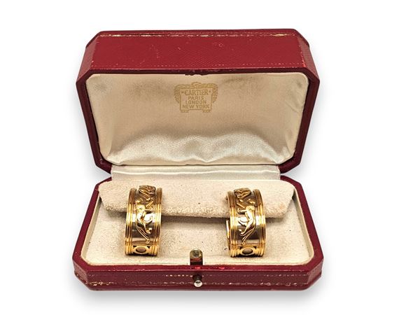 CARTIER - Collezione "Walking Panthère": orecchini a nastro pendente in oro    