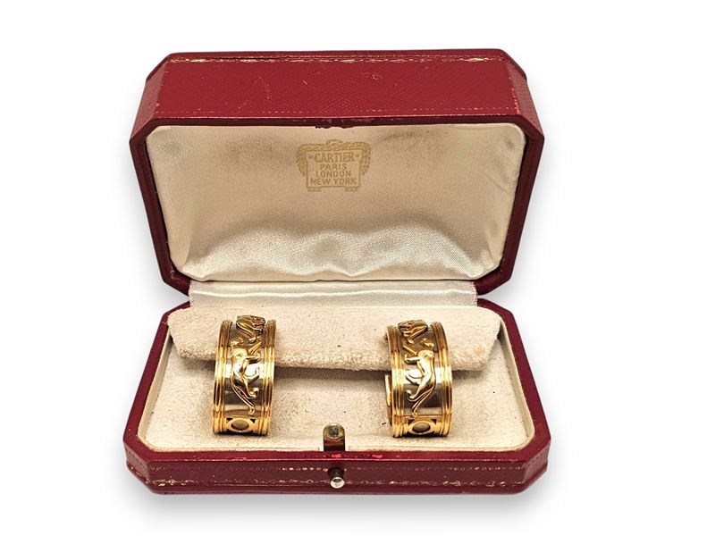Cartier - Collezione “Walking Panthère”: orecchini a nastro pendenti in oro 18k (oro giallo e oro...