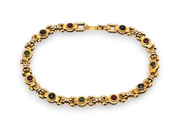 Bracciale in oro con rubini, zaffiri e smeraldi   