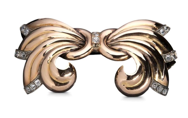 Spilla in stile Art Déco, oro bianco e oro giallo con diamanti