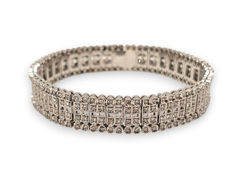 Bracciale in platino con diamanti, motivo a nastro snodato e pavé