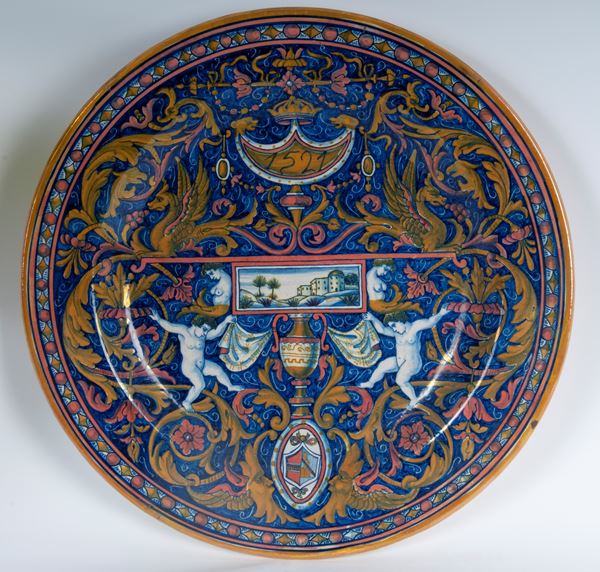 Coppia di piatti da pompa in ceramica a lustro