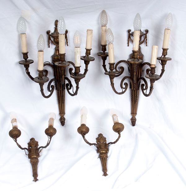 Lotto di quattro appliques in bronzo da parete