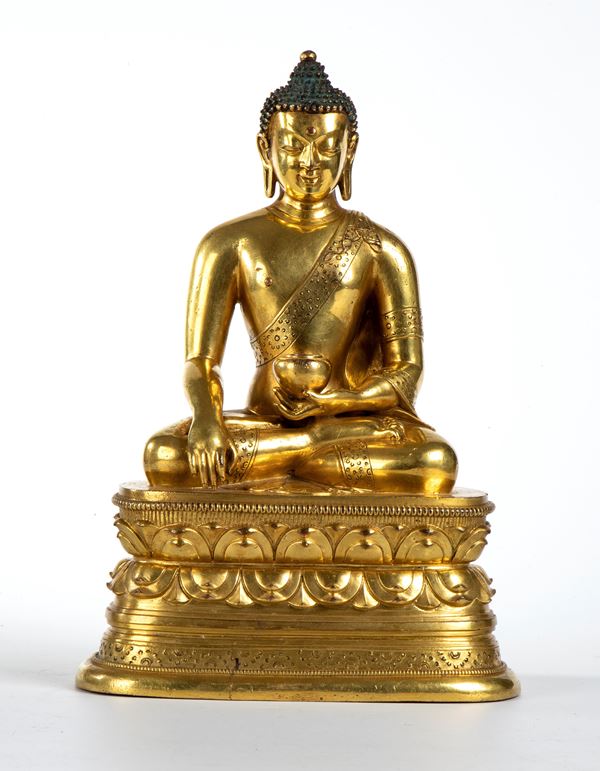 Figura di Buddha in bronzo dorato