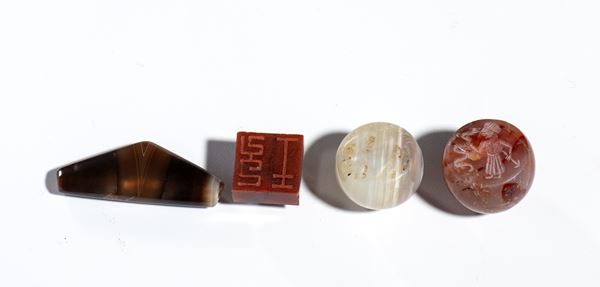 Group of Sassanian agate seals and veined agate beads, Iran and China