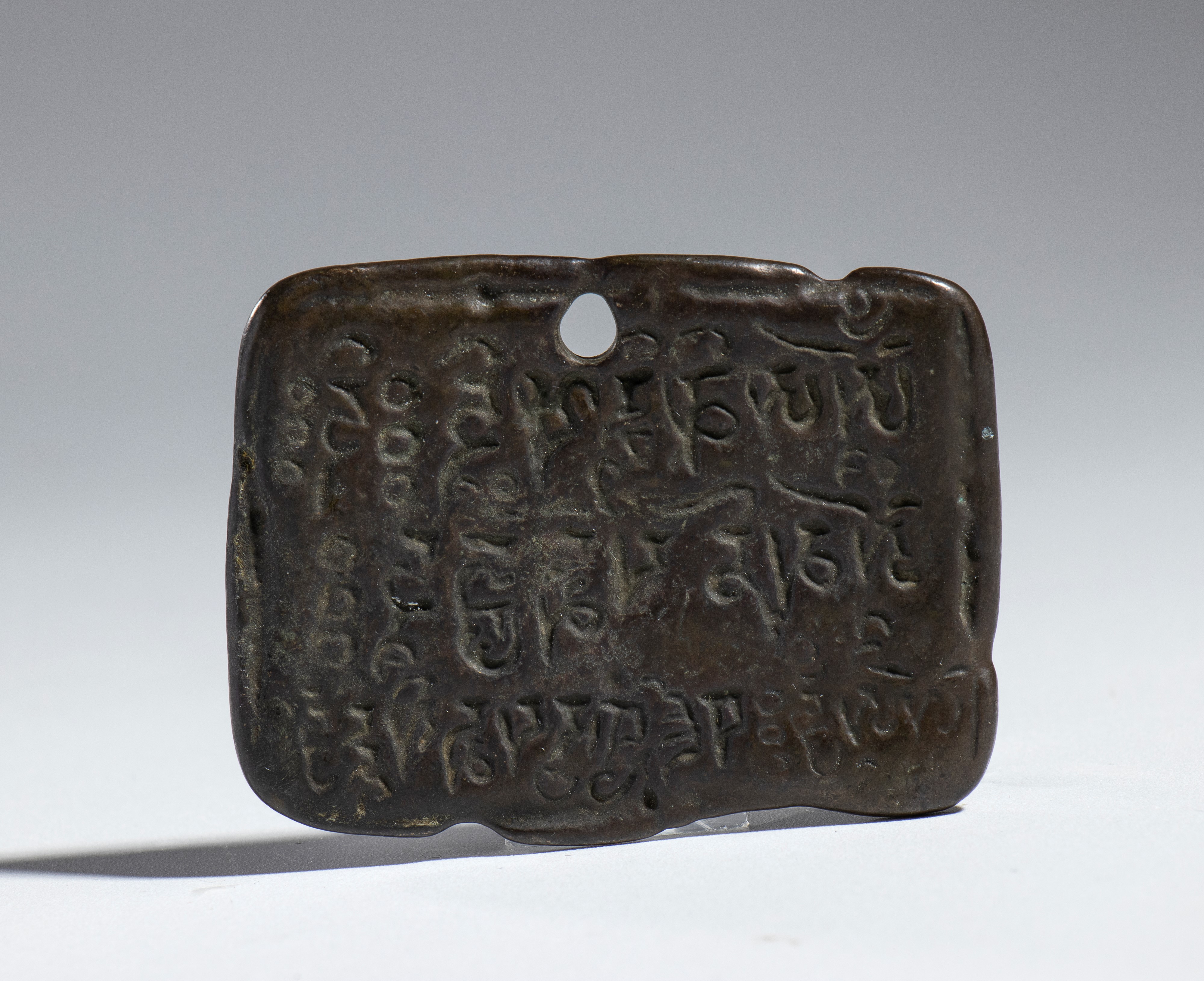 Amuleto buddista in bronzo legato, Cina