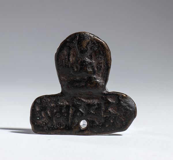 Bound bronze Buddhist amulet, China