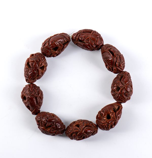 Bracciale in nocciolo di oliva intagliata, Cina