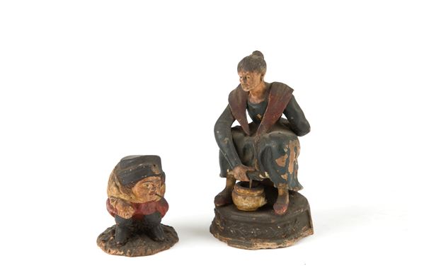 Coppia di sculture in terracotta policroma