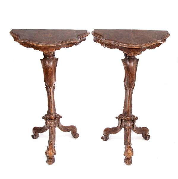 Pair of carved wooden wall-mounted side tables in the Louis XV style