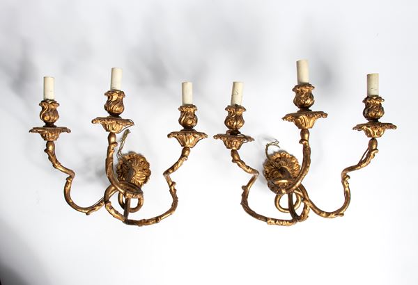 Pair of carved and gilded wooden wall sconces