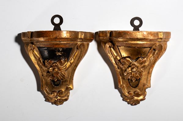Pair of small carved and gilded shelves