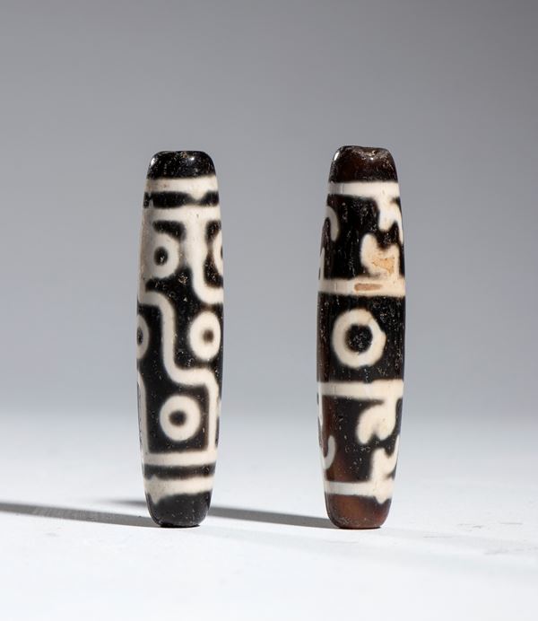 Two Buddhist Dzi amulets made of agate, Tibet, China