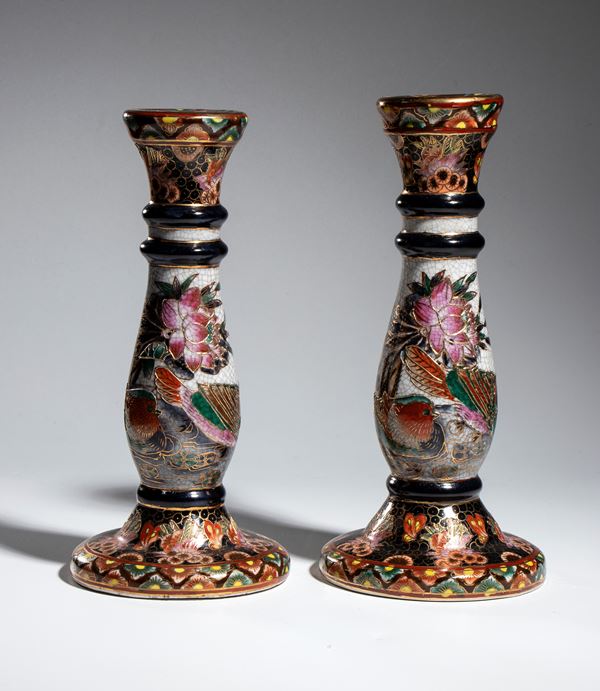 Pair of ceramic candlesticks and a white and blue vase, China