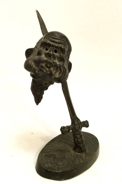 Fermacarte in bronzo, Testa di Franz Joseph trafitta da spada Sabauda