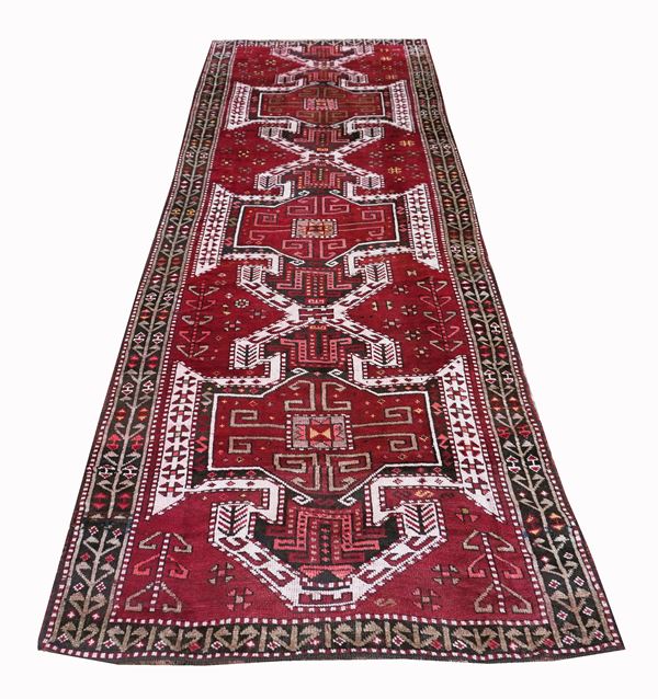 A Kazak long rug with shield designs