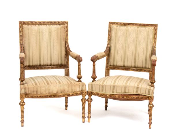 A pair of French gilt armchairs, Louis XVI style