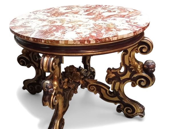 Tavolo tondo in legno dorato e ebanizzato