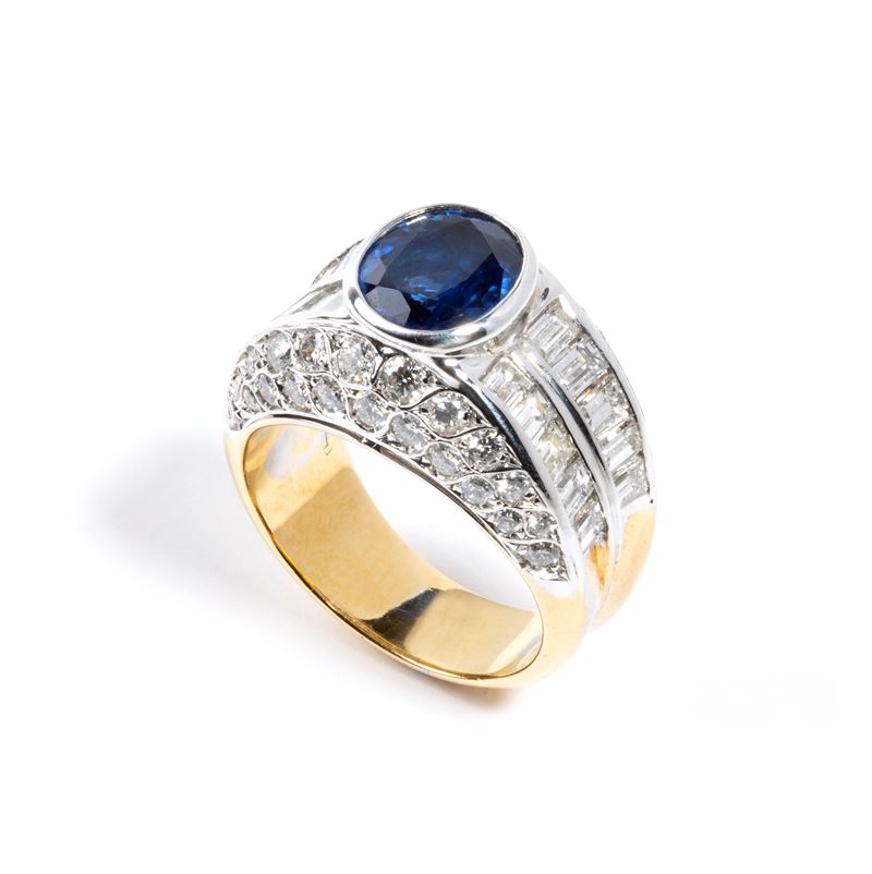Anello a fascia in oro con zaffiro e diamanti