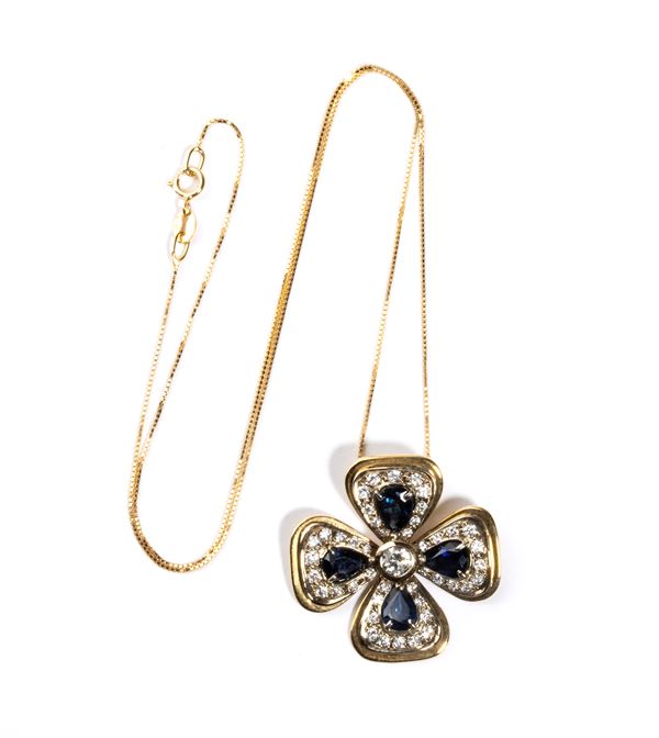 Necklace and four-leaf clover pendant with sapphires and diamonds