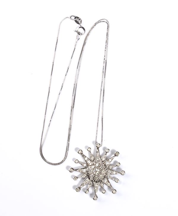 Necklace with a gold diamond pendant