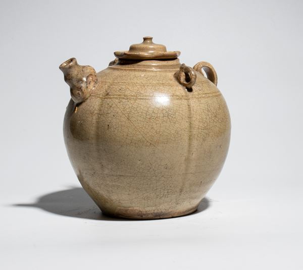 Antique ceramic teapot with a cracked white glaze. Vietnam, Ly dynasty, 11th-12th century.