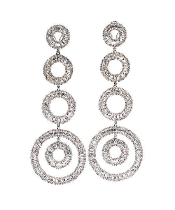 A pair of gold and diamond drop earrings