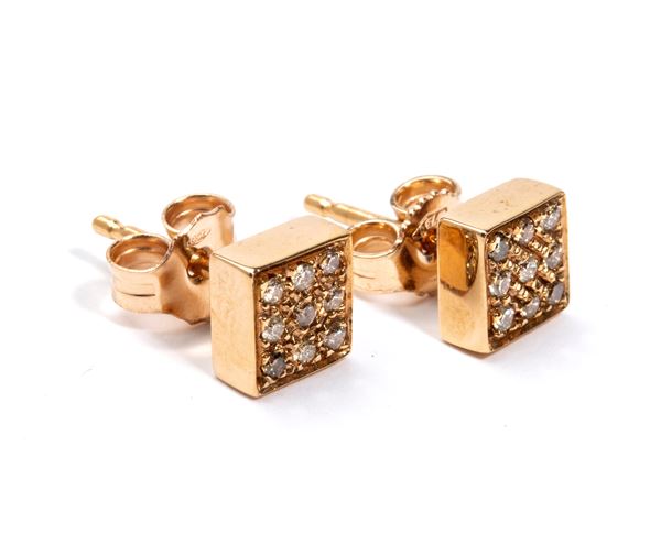 A pair of geometric gold and diamond earrings