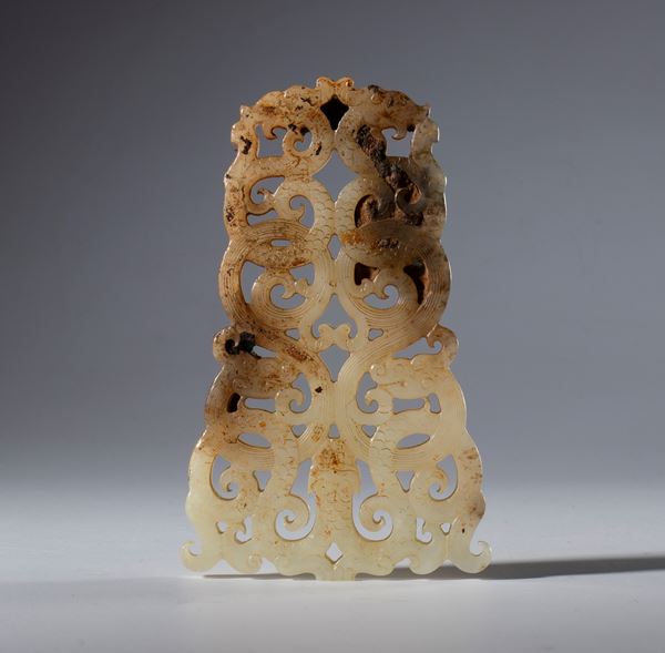 A Hotan jade plaque carved and engraved with dragon figures. China, 18th century