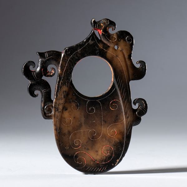 A dark Hotan jade archer's ring. China, 18th century.