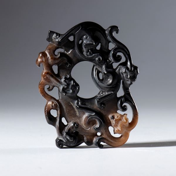 Ornamental BI disk in Hotan jade decorated with dragon figures relief. China, 18th century.