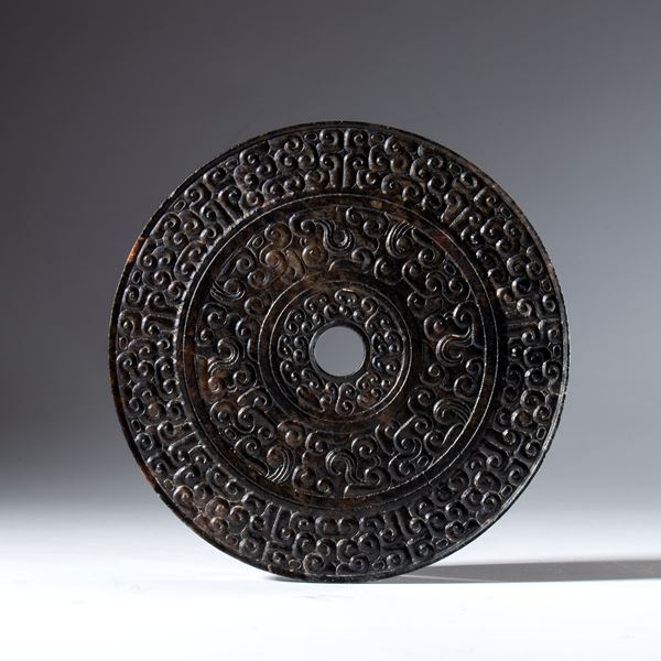 Hotan jade BI ritual disc engraved with a cloud motif. China, 18th century.