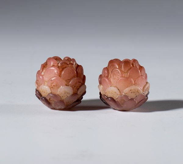A pair of blown glass lotus-shaped beads. China, 19th century