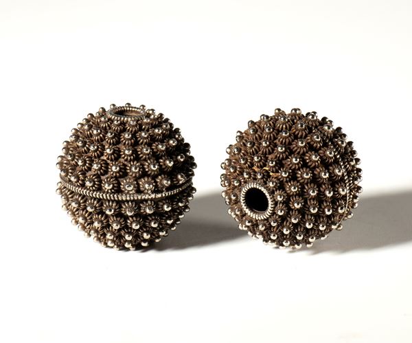 A pair of large ornamental beads in copper and silver alloy. China, 19th century