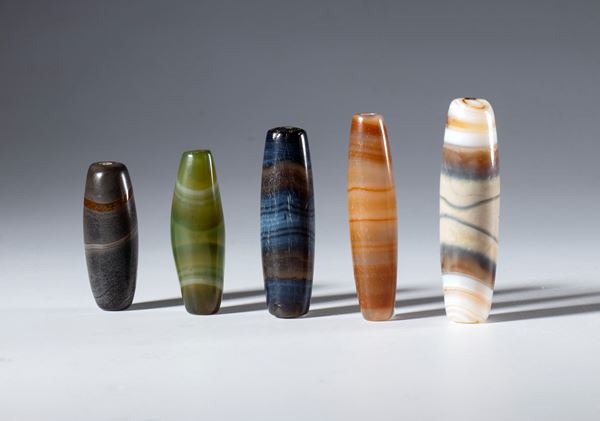 A lot of five tubular zoned agate beads. Tibet, 19th century.