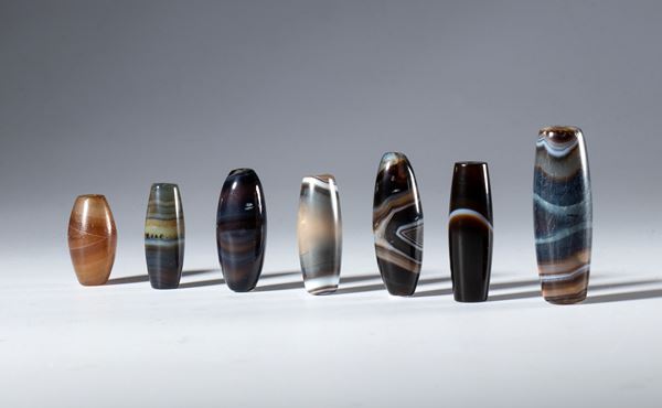 A lot of seven tubular zoned agate beads. Tibet, 19th century.