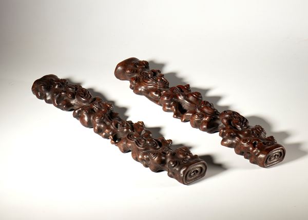 A pair of carved wooden calligraphy paperweights. China, 19th century