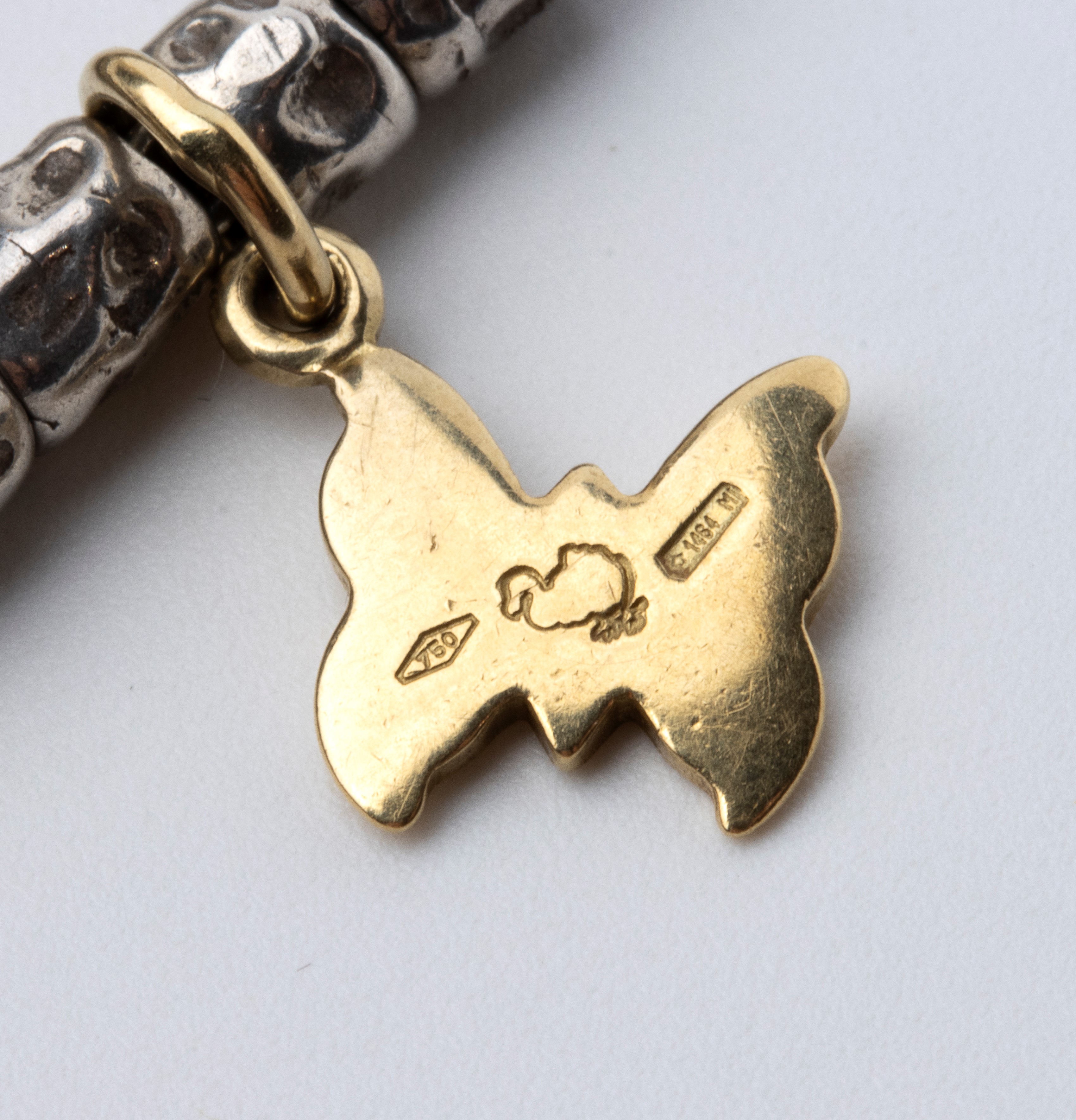 Bracciale con pepite in argento ed oro rosa, pendenti in oro