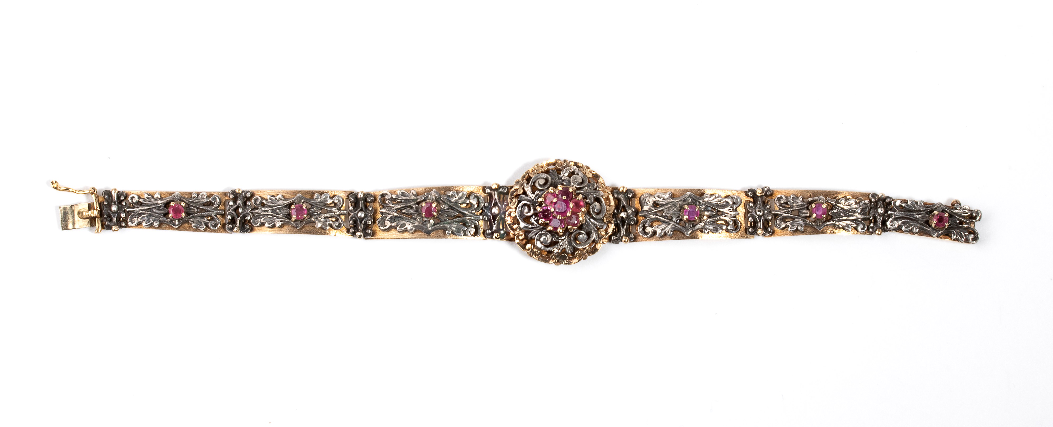 Bracciale in oro giallo 18k e argento, con inserti floreali e rubini