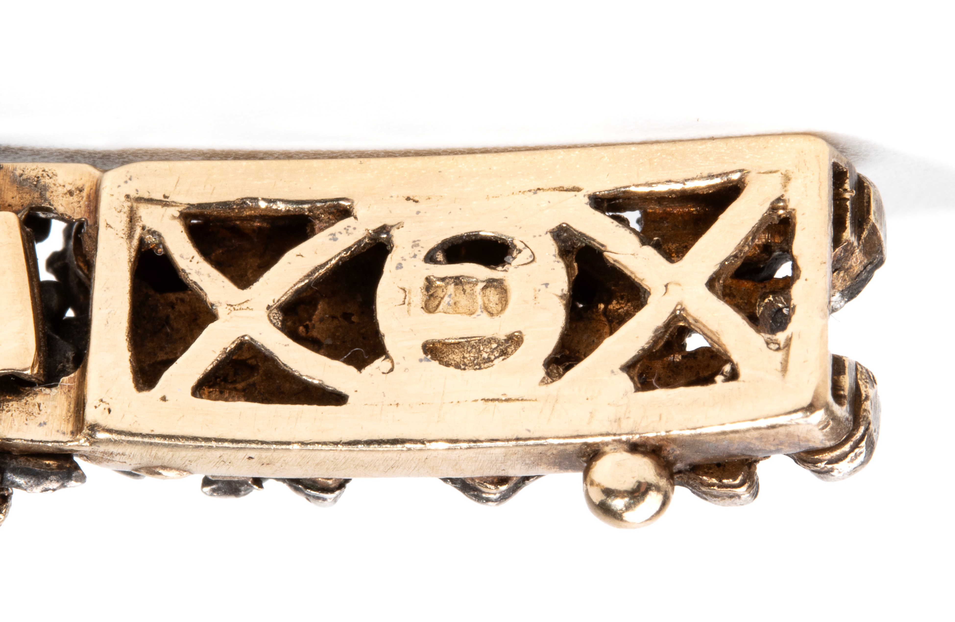 Bracciale in oro giallo 18k e argento, con inserti floreali e rubini
