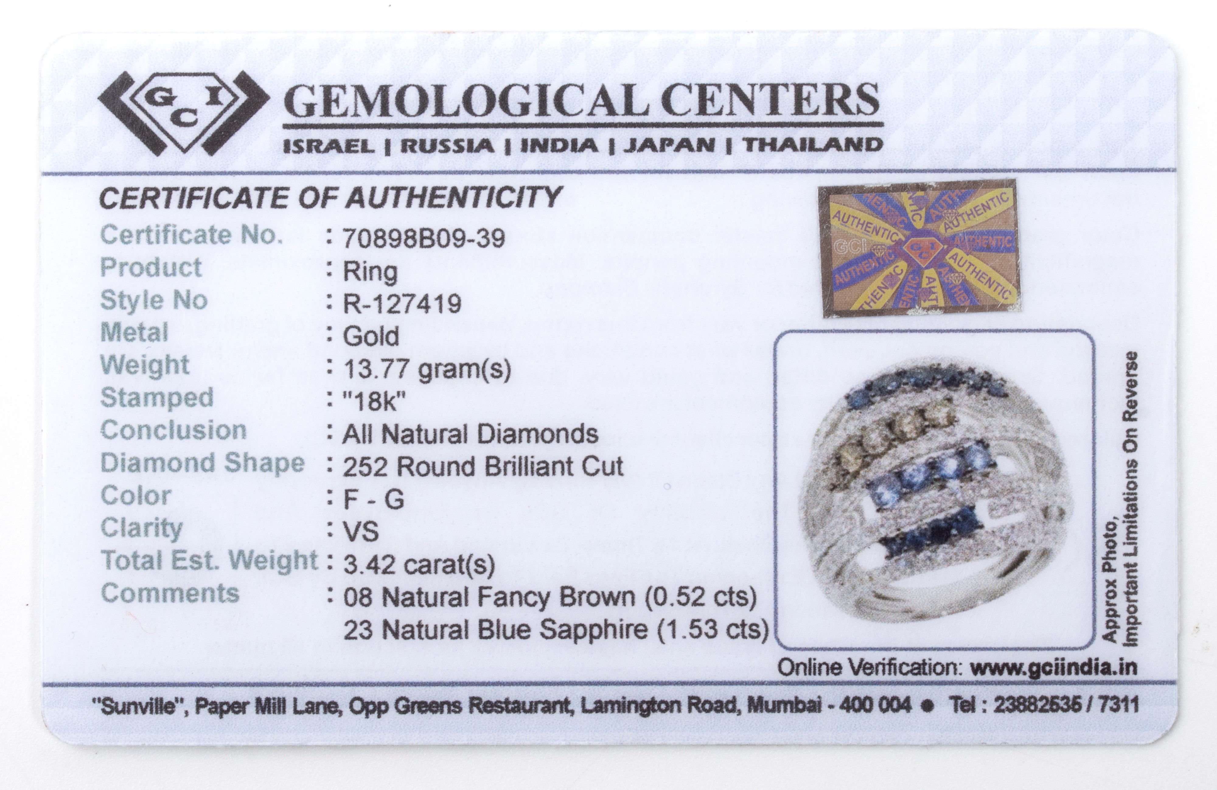 Anello a fascia in oro con diamanti e zaffiri