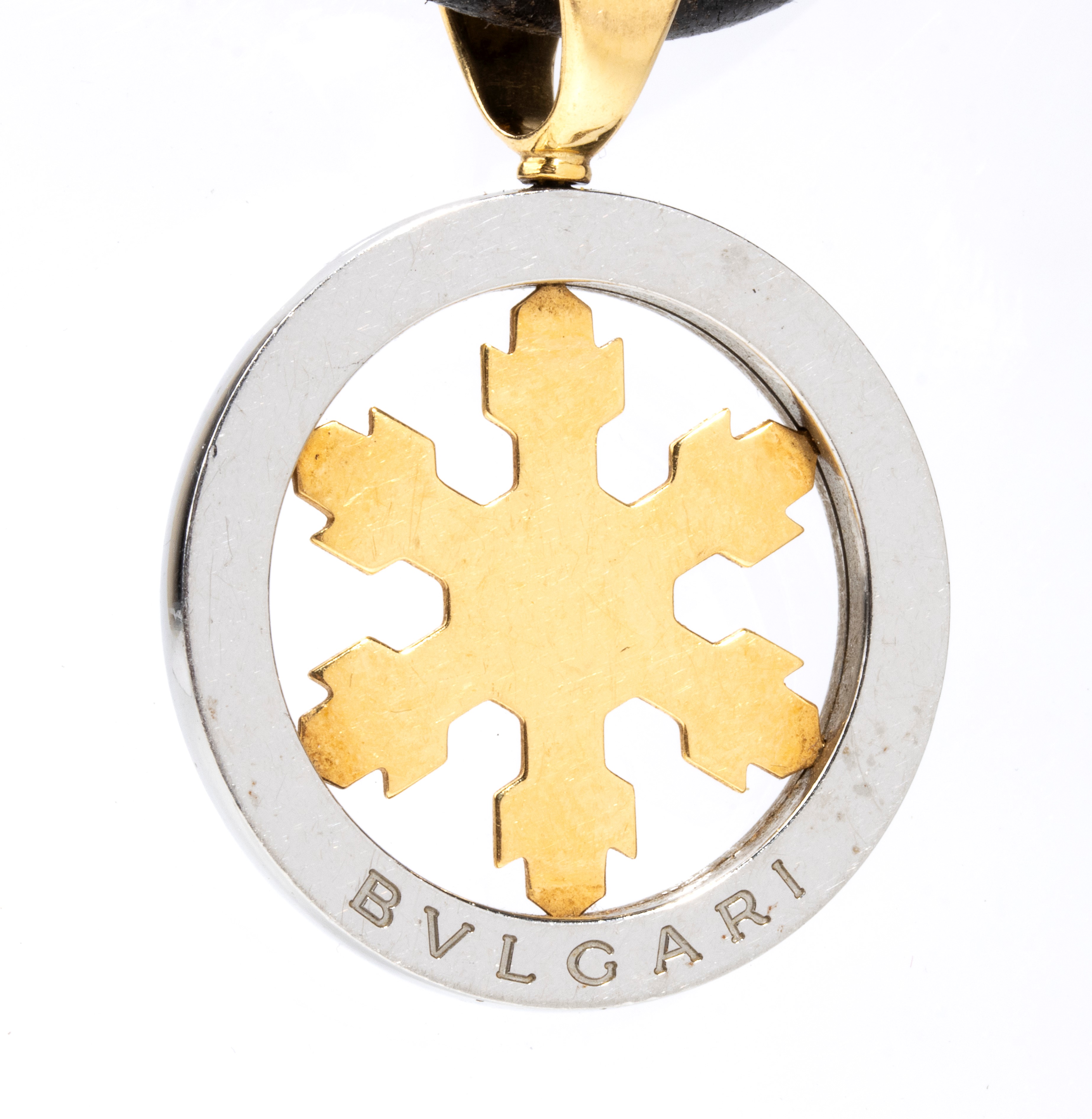 Collezione Tondo: girocollo in cuoio con pendente in acciaio ed oro