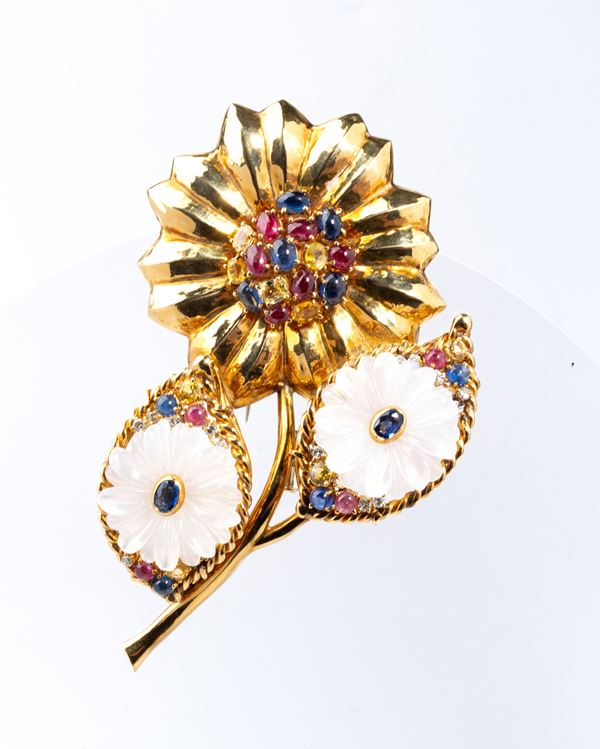 Gold brooch with precious stones