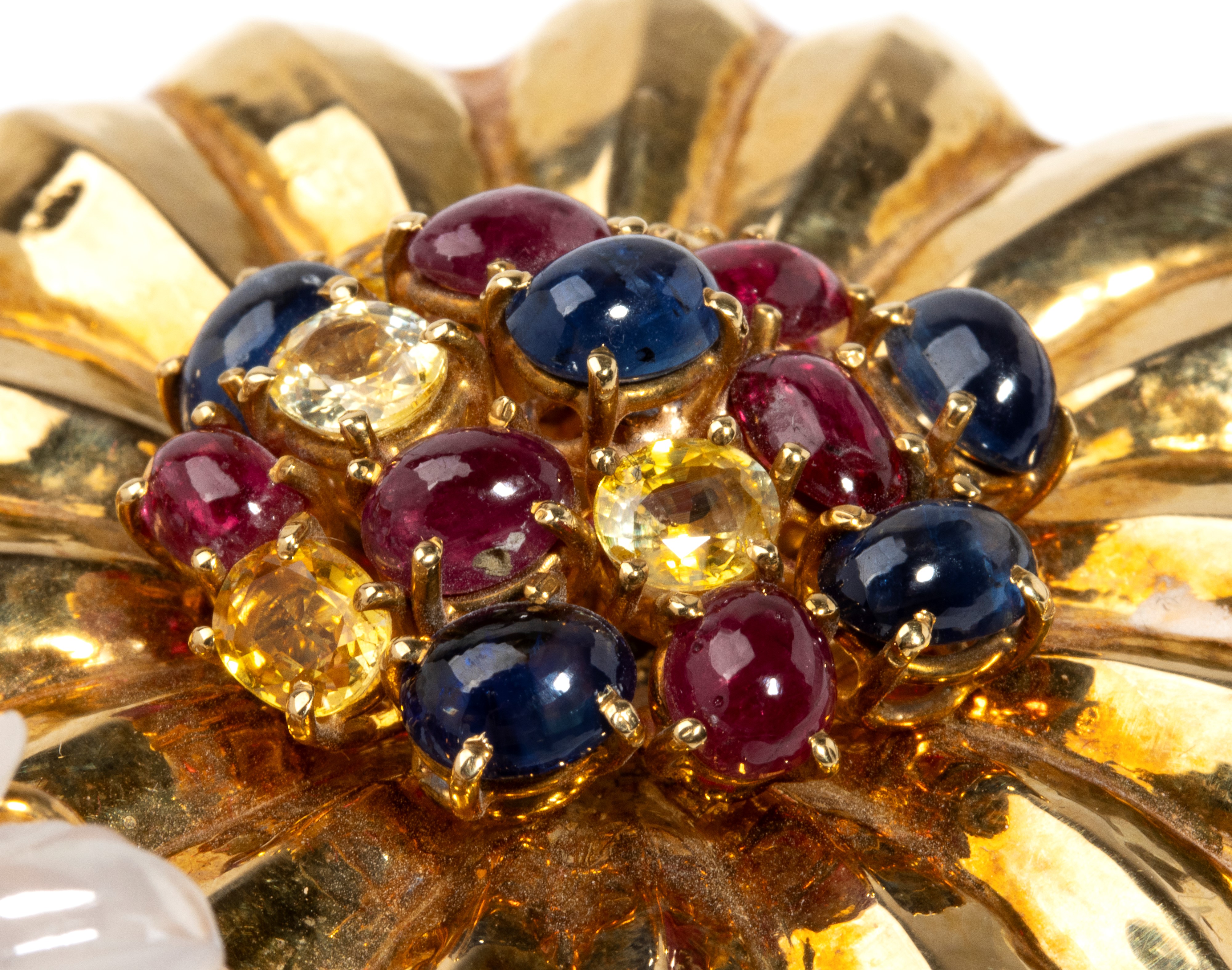 Spilla in oro con pietre preziose