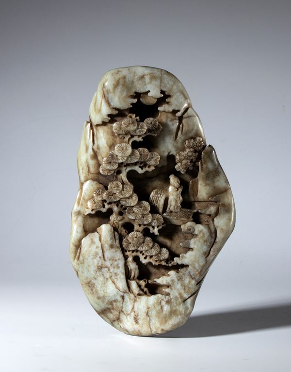 Decorative sculpture carved from a block of Hotan jade depicting a lake landscape with vegetation and a sage. China, 19th century.