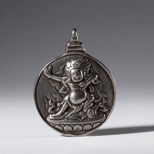 Jiu Gong Ba Gua amulet, made of silver alloy with a depiction of Mahakala. Tibet, 20th century