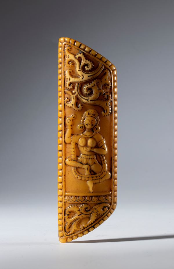 Part of a carved and engraved Buddhist ritual apron made of buffalo bone. Tibet, 19th century.