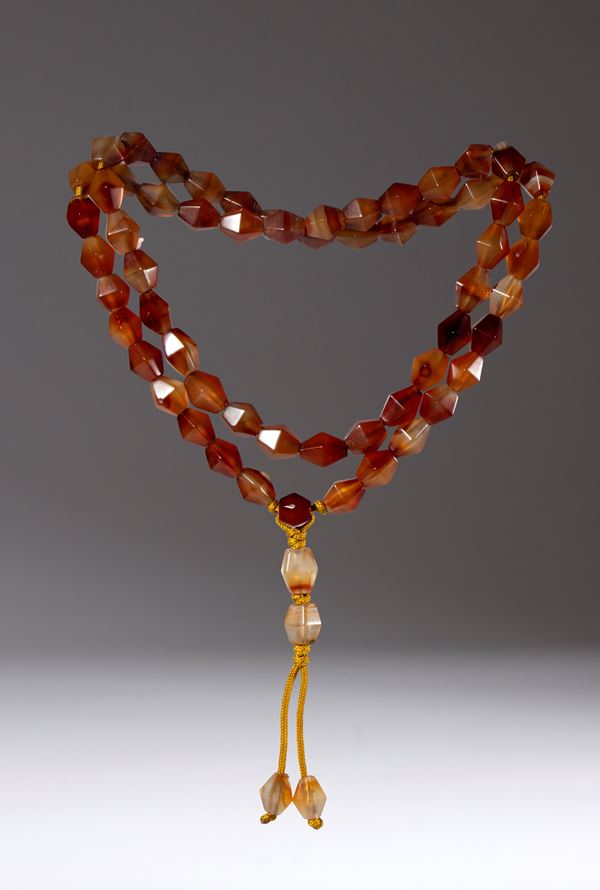 Mala composed of 64 polyhedral agate beads. China, 19th century.