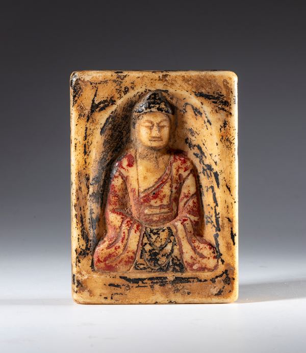 White marble relief with traces of polychromy depicting Buddha in meditation. China, 19th century.