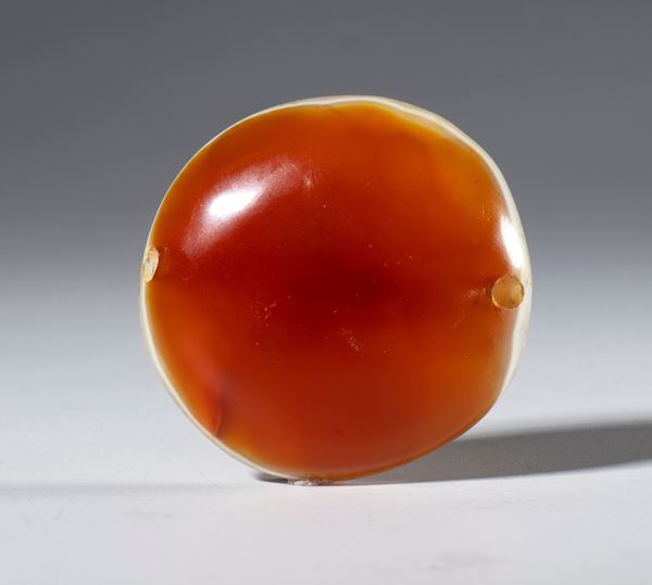A Lukmik bead in orange-white zoned agate. Tibet, 19th century